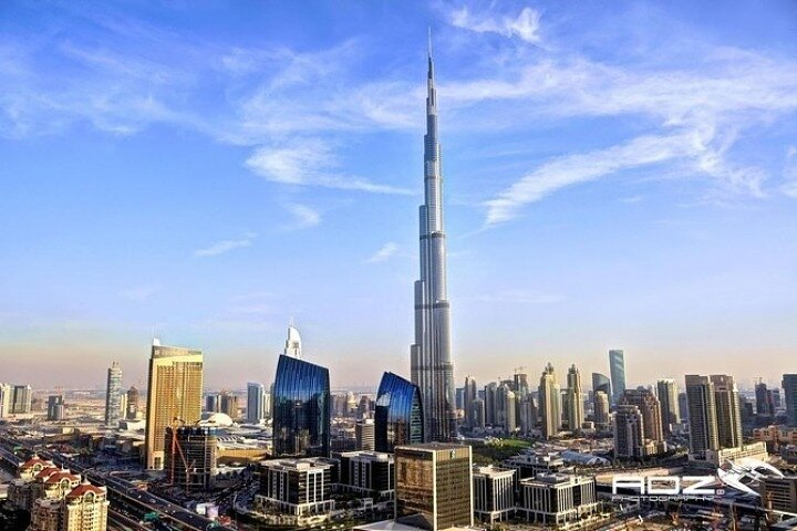 Discover the iconic skyline of Dubai featuring the towering Burj Khalifa amidst a blend of modern architecture and rich history—ideal for those eager to explore the city's multifaceted charm.